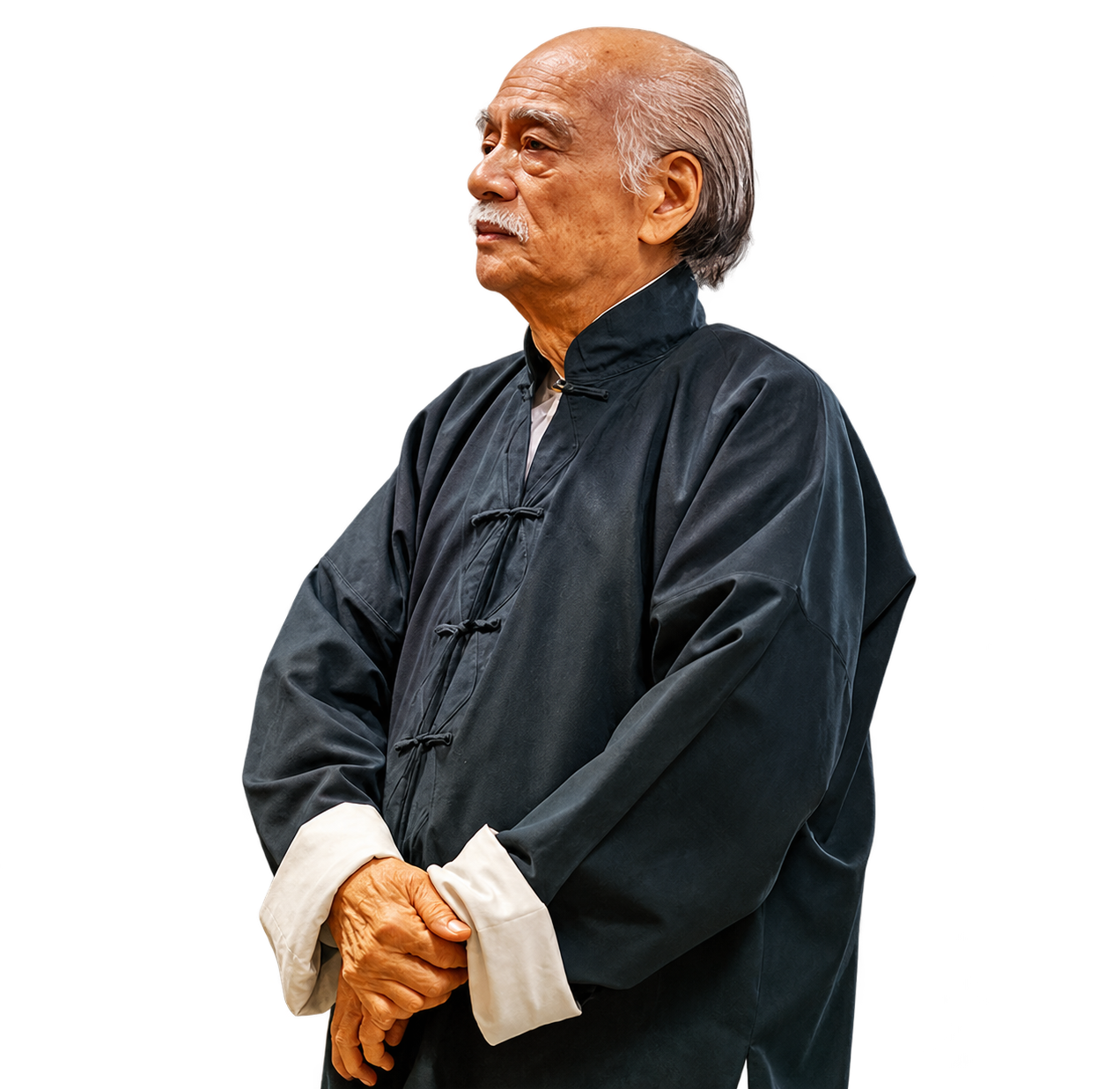 Grand Maître Nam Anh, les mains jointes, lors de la célébration de janvier 2026